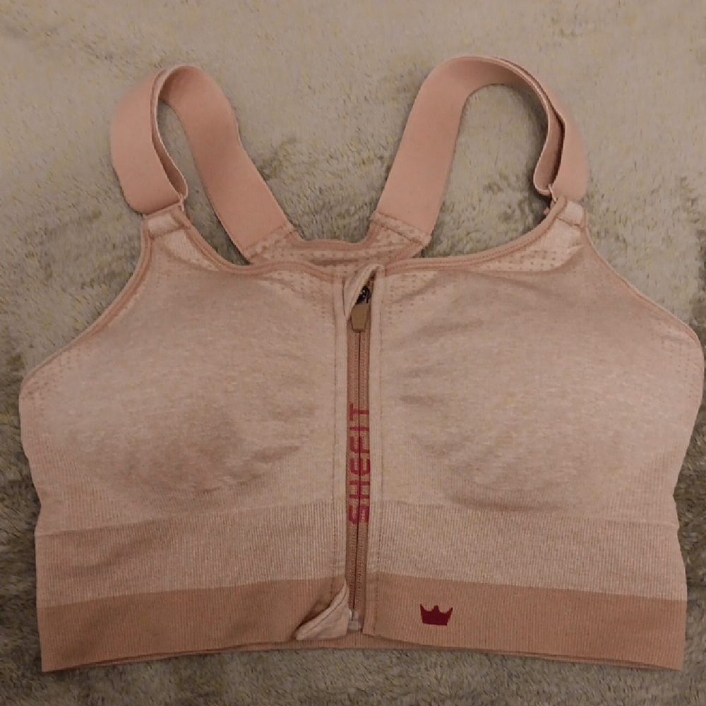 SHEFIT Cream Sports Bra with Zipper Closure and Wide Straps.  1Luxe